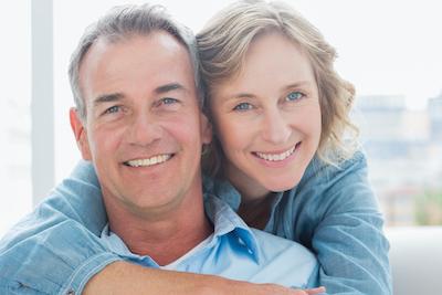 middle aged man and woman smiling