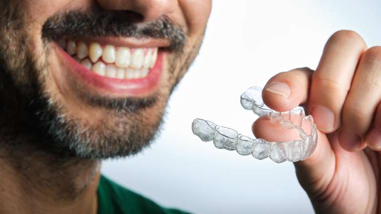 man using clear aligners in germantown