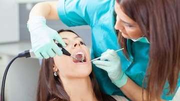 female patient getting a dental cleaning in germantown