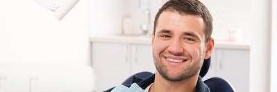man smiling after visiting his dentist in Germantown