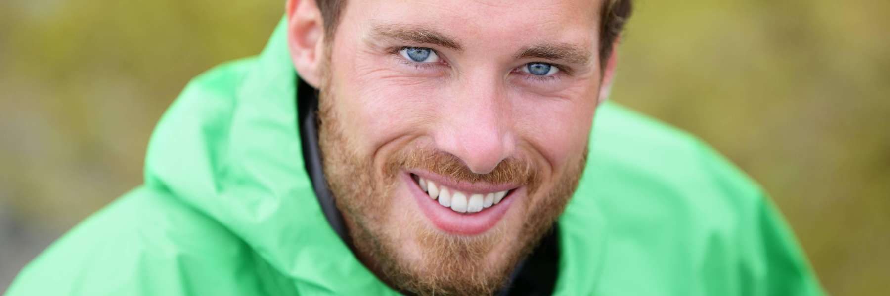 man smiling after getting a dental implant in Georgetown