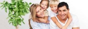 family of four smiling